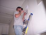 Eye Spy Electronics Tech Installing Alarm Panel for security monitoring in st.charles county o'fallon missouri